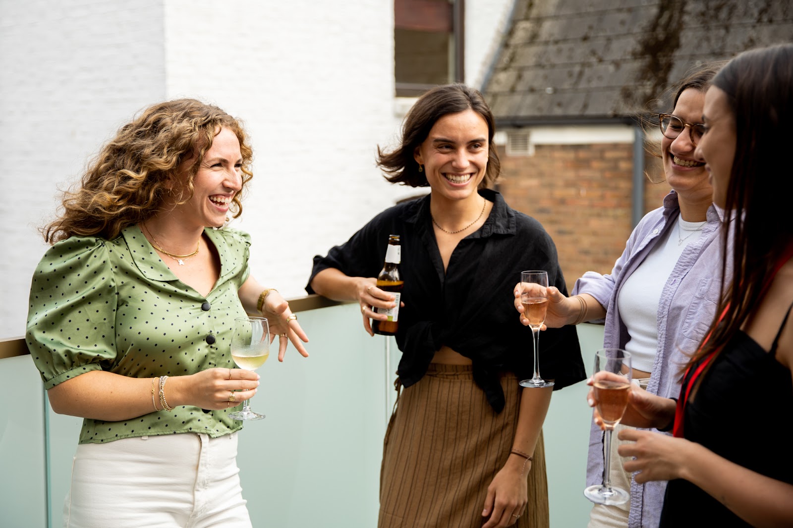 Anna Muñoz Farré Sharing drinks and laughter with colleagues at a BenevolentAI happy hour in London